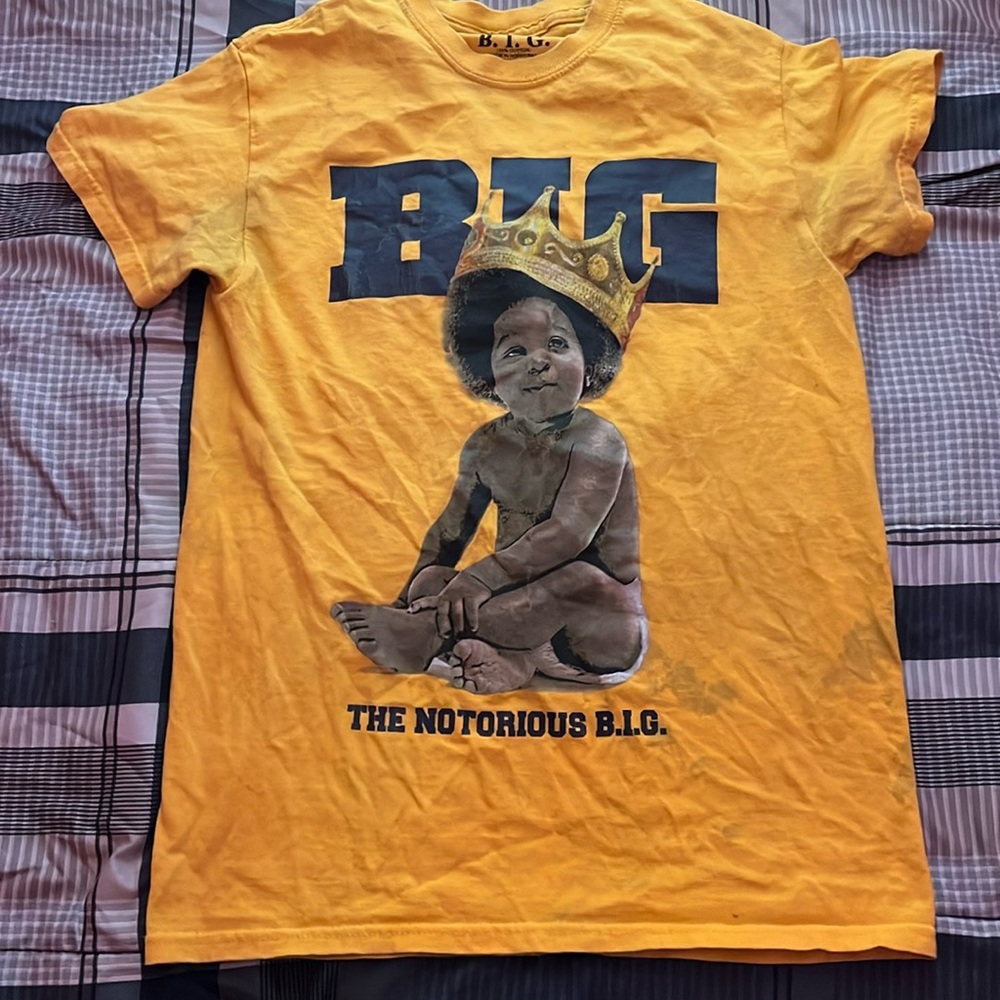 Shirt has a few stains that can be fixed with a wash!